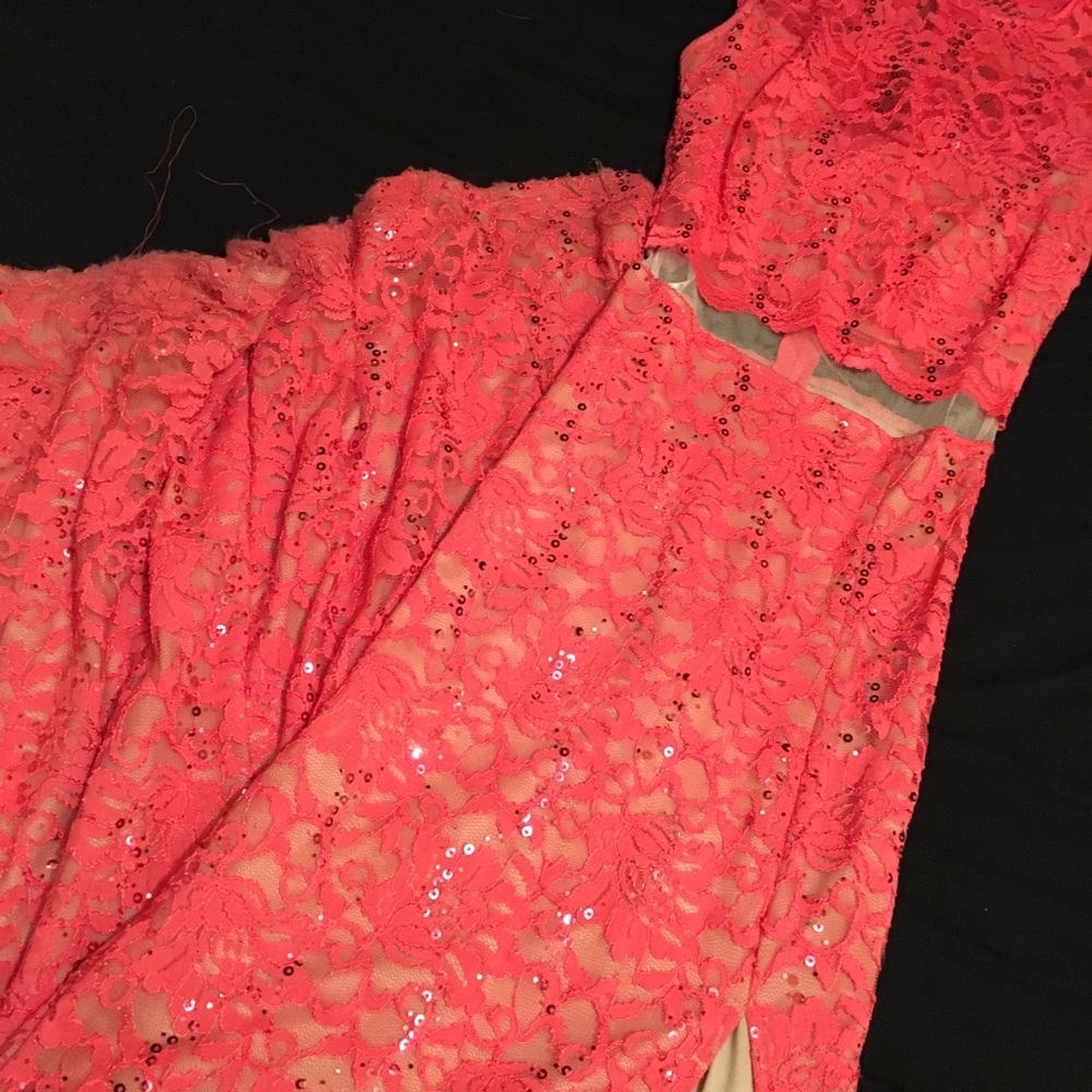 Super long salmon prom dress.